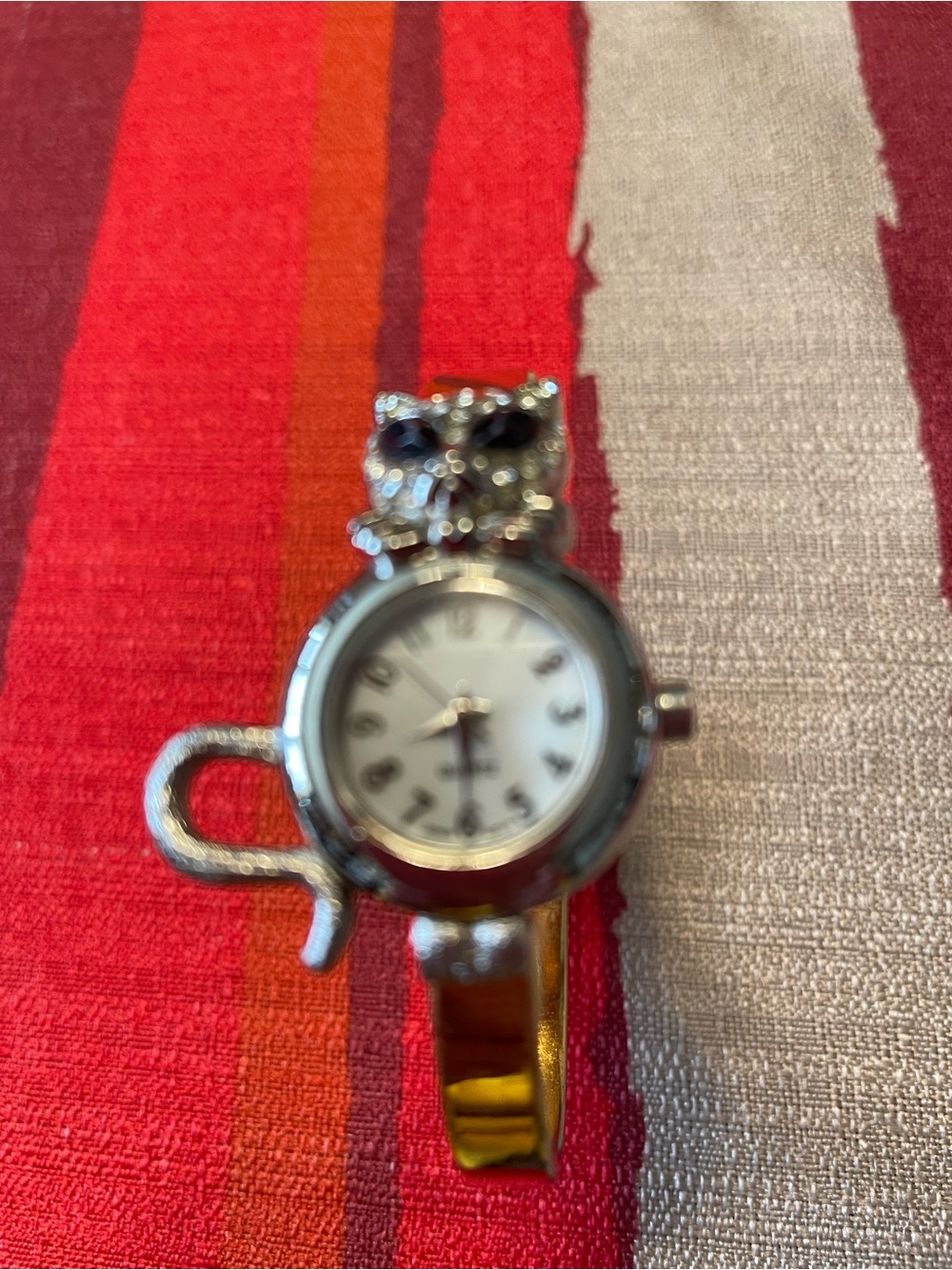 Silvertone Cat Bracelet Watch with White Dial. Golden bracelet band
